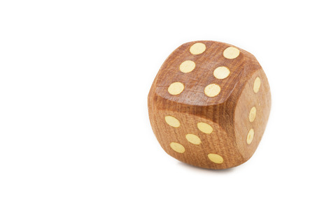 Single wooden dice, isolated on white