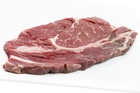 Single piece of ox loin on a white plateの写真素材