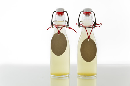 Bottles filled with elderflower syrupの写真素材