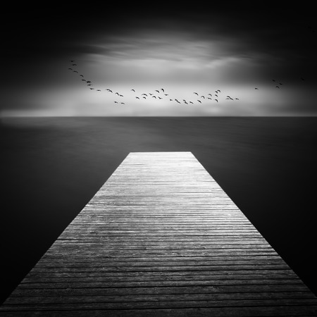 Jetty on a lake in Bavaria, Germany, long time exposureの写真素材
