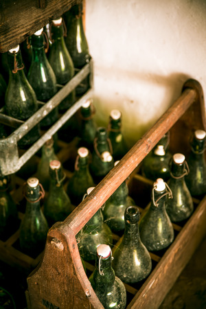 Old beer bottles in wooden casesの写真素材