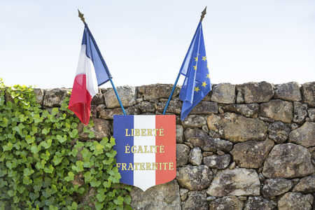 French and European flags on a stone wallの写真素材