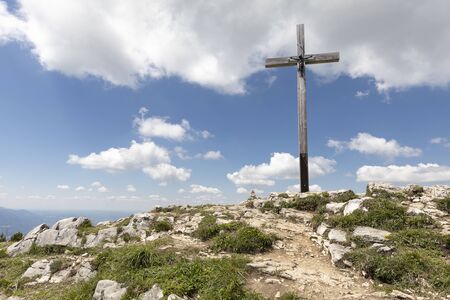 Summit cross on the Hochries peak in Bavaria, Germanyの写真素材