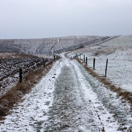 Slightly snow-covered dirt road.の写真素材