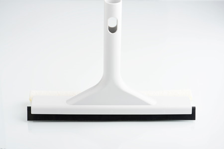 Close-up of windshield cleaning tool on on white background
