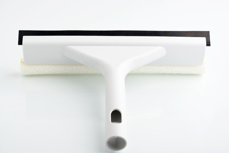Close-up of windshield cleaning tool on on white background