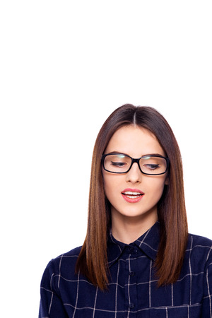Bashful beauty. Cropped shot of a beautiful woman in glasses.の写真素材