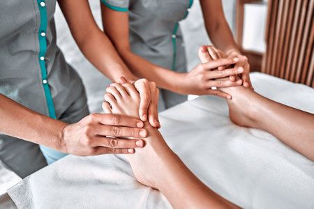 Enjoying and relaxing healthy foot massage. Close up viewの写真素材