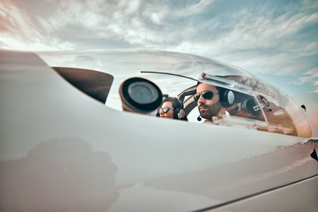 Serious pilots in a small plane. Close up viewの写真素材