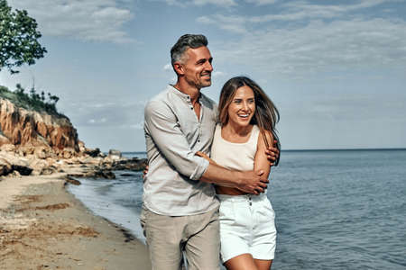 Attractive couple cuddling at the beach. Close up view.の写真素材