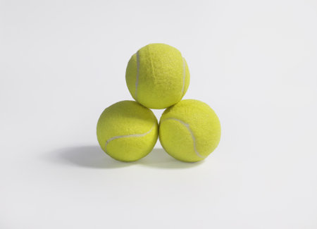 three Tennis balls isolated on white background with copy space for text.の写真素材