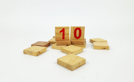 the number 10 written on wood are rectangular and have a white background