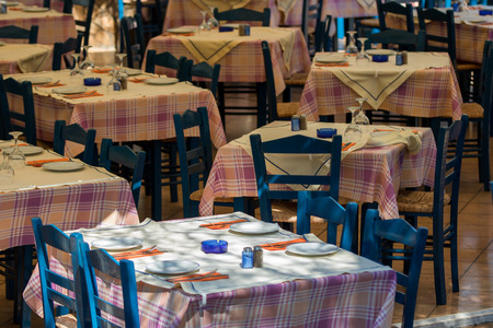 Lunch table settings in a Greek style restaurant