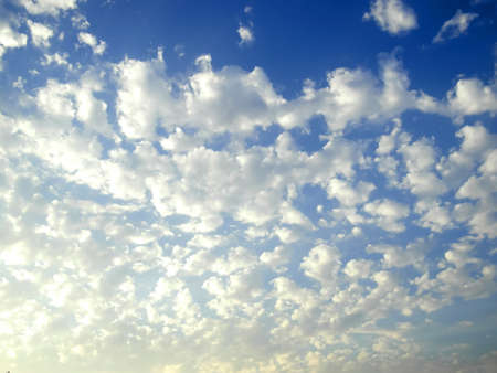 The blue sky, the clouds are scattered
Small clumps all over the skyの写真素材