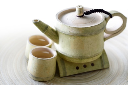 Close-up of tea in a antique cup and Teapotの写真素材