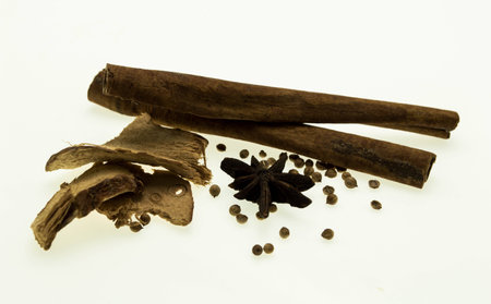 Various spices on a white background.