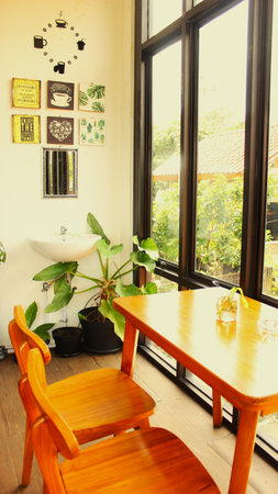 Wooden Table and Chairs in Cozy CafÃ© Interiorの写真素材
