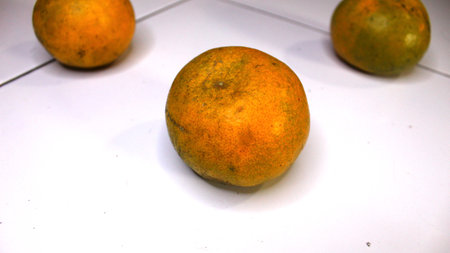 Orange fruit on a white background. Selective focus and shallow depth of fieldの写真素材