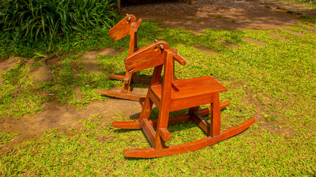 Wooden Horse Chair in Childrens Playground, Eco-Friendly Mini Gardenの写真素材