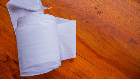 White Tissue Roll on Wooden Table â Minimalist Everyday Objectの写真素材