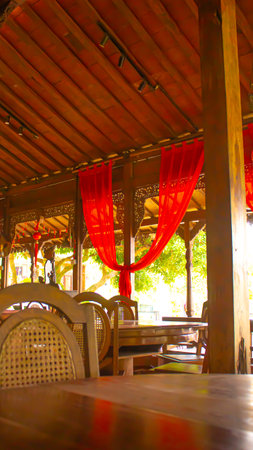 Classic Wooden Restaurant Interior, Rustic and Cozy Ambiance of javaの写真素材