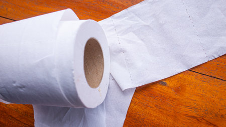 White Tissue Roll on Wooden Table â Minimalist Everyday Objectの写真素材