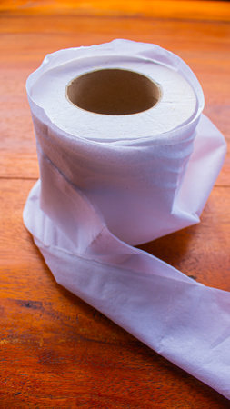 White Tissue Roll on Wooden Table â Minimalist Everyday Objectの写真素材