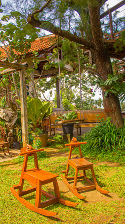 Wooden Horse Chair in Childrens Playground, Eco-Friendly Mini Gardenの写真素材