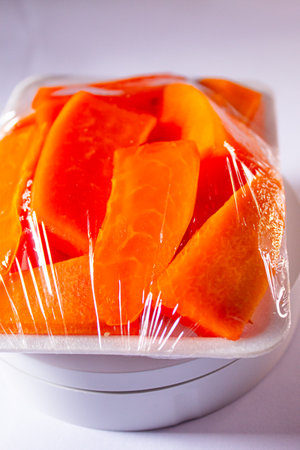 Sliced Papaya in Food Grade Plastic Wrap, Ready to Eat Fruit Packagingの写真素材