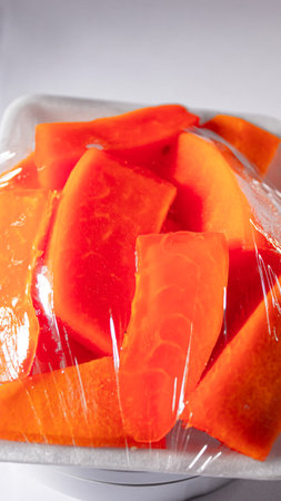 Sliced Papaya in Food Grade Plastic Wrap, Ready to Eat Fruit Packagingの写真素材