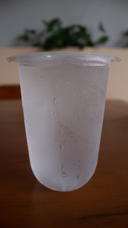 Chilled Mineral Water with Ice in Plastic Cupの写真素材