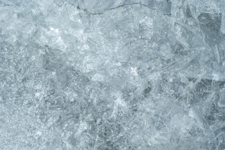 texture, background: cold shiny ice surface with cracks, patterns and bubbles, consisting of ice...