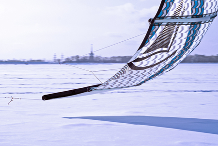 PERM, RUSSIA - FEBRUARY 23, 2018: fragment of a kite for snowkiting, rushing low over the iceのeditorial素材