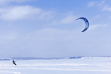 PERM, RUSSIA - FEBRUARY 23, 2018: snow kiter glides on the ice of the Kama Reservoirのeditorial素材