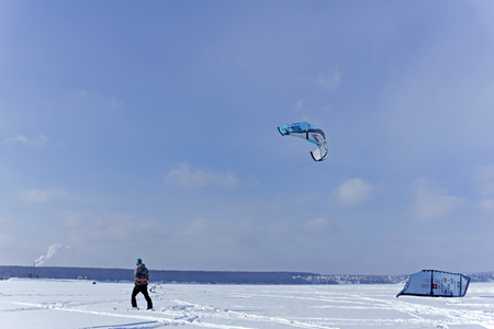 PERM, RUSSIA - FEBRUARY 23, 2018: snow kiter glides on the ice of the Kama Reservoirのeditorial素材