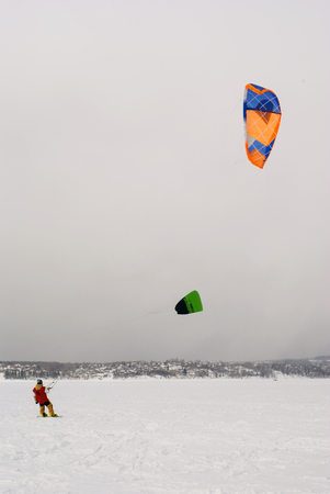 PERM, RUSSIA - MARCH 09, 2018: snow kiters glides on the ice of the Kama Reservoirのeditorial素材