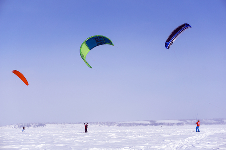 PERM, RUSSIA - MARCH 09, 2018: snow kiters glides on the ice of the Kama Reservoirのeditorial素材