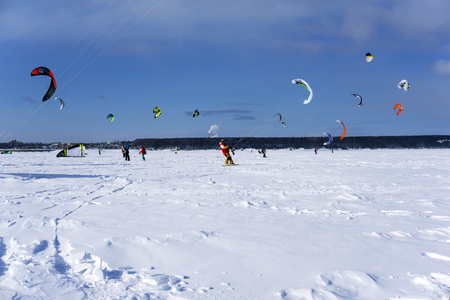 PERM, RUSSIA - MARCH 09, 2018: snow kiters rides on the ice of a frozen riverのeditorial素材