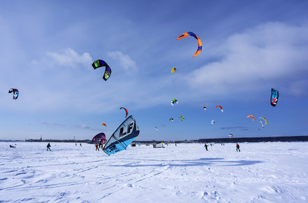 PERM, RUSSIA - MARCH 09, 2018: snow kiters rides on the ice of a frozen riverのeditorial素材