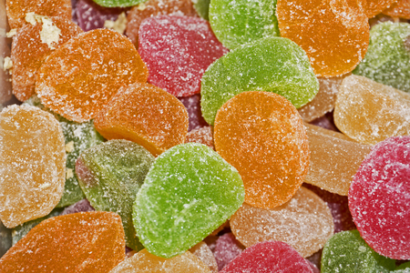 background - multycolored slices of marmalade in sugarの写真素材