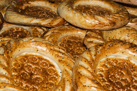 background - a bunch of freshly baked round traditional Asian tandoor breads

の写真素材