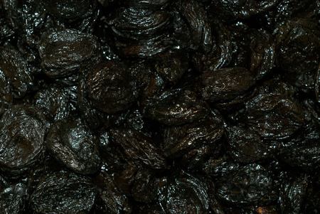  background - sun dried black plums with rainbow tint closeup

の写真素材