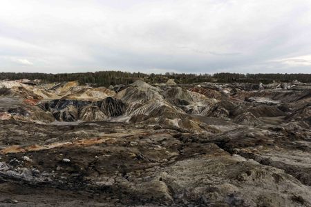 multicolored industrial dumps at the mining site of minerals by open method
