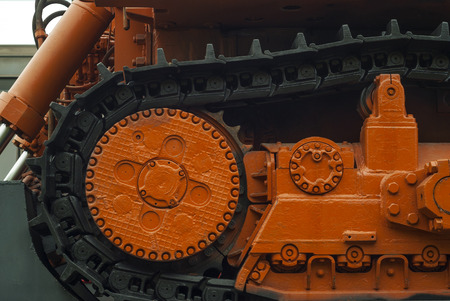 fragment of caterpillars of a heavy bulldozer for emergency repair works, standing on a railway...