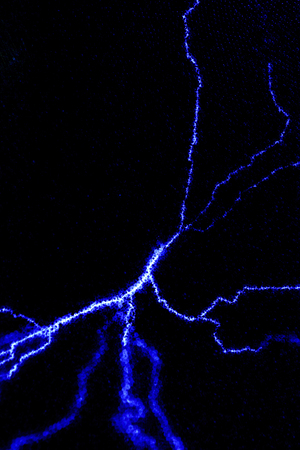 background - lightning, static discharge in inert gas on a dark background
