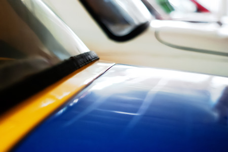 blurred background - vintage cars in the parking lotの写真素材
