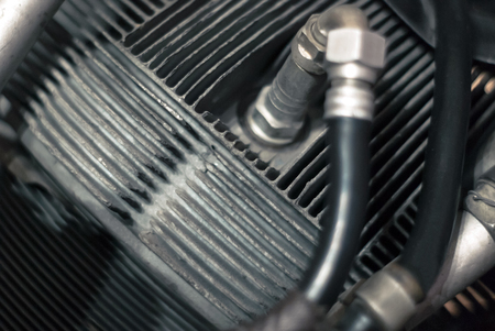 fragment of the cylinder of an aircraft piston engine with a fuel supply system, partially blurred...