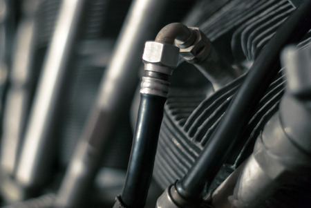 fragment of the cylinder of an aircraft piston engine with a fuel supply system, partially blurred backgroundの写真素材