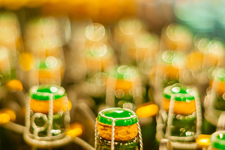blurred background - corks on bottles of sparkling wine