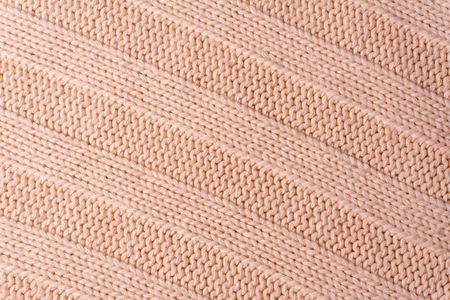 Background, texture - the surface of wool knitted fabric close up